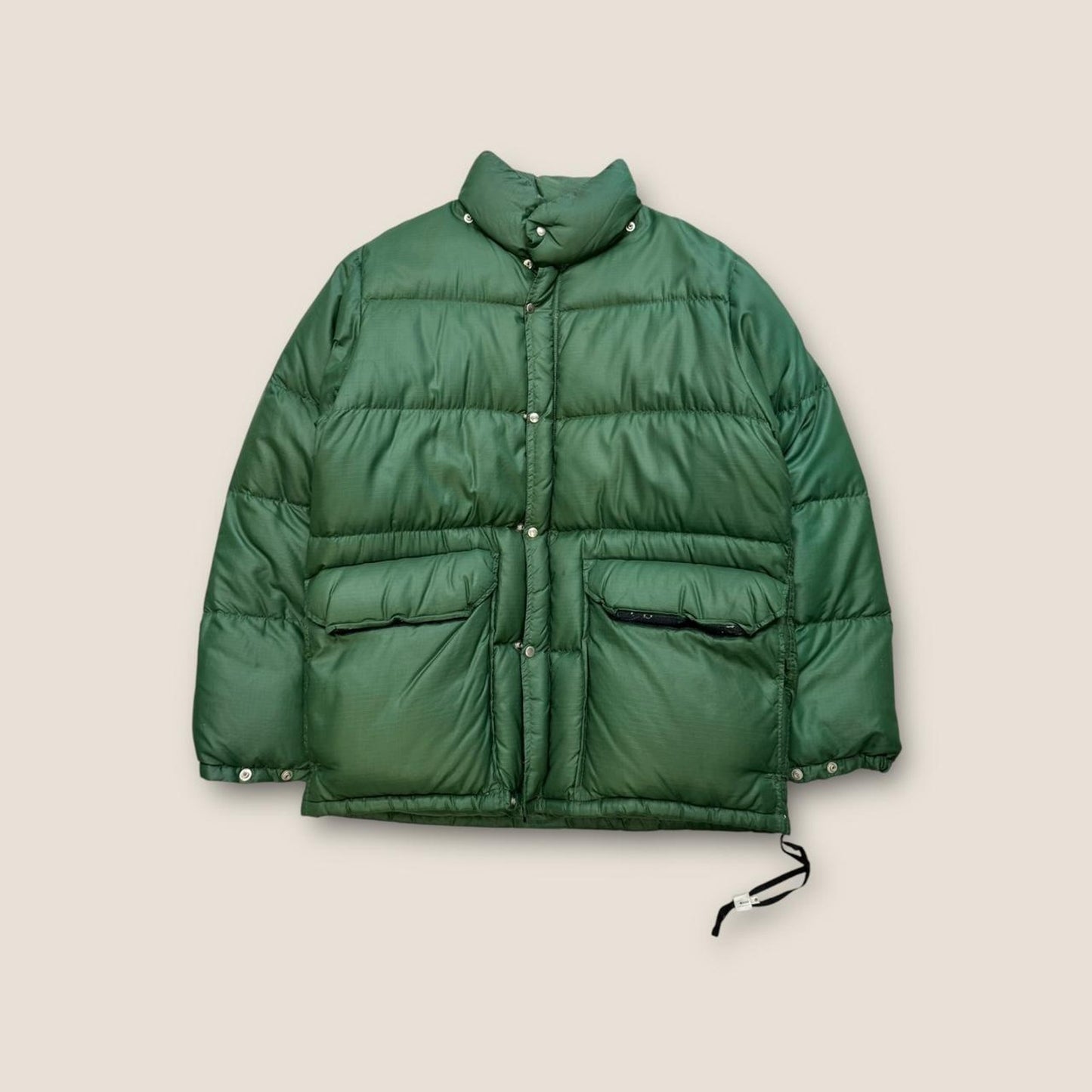 Green puffer jacket with adjustable