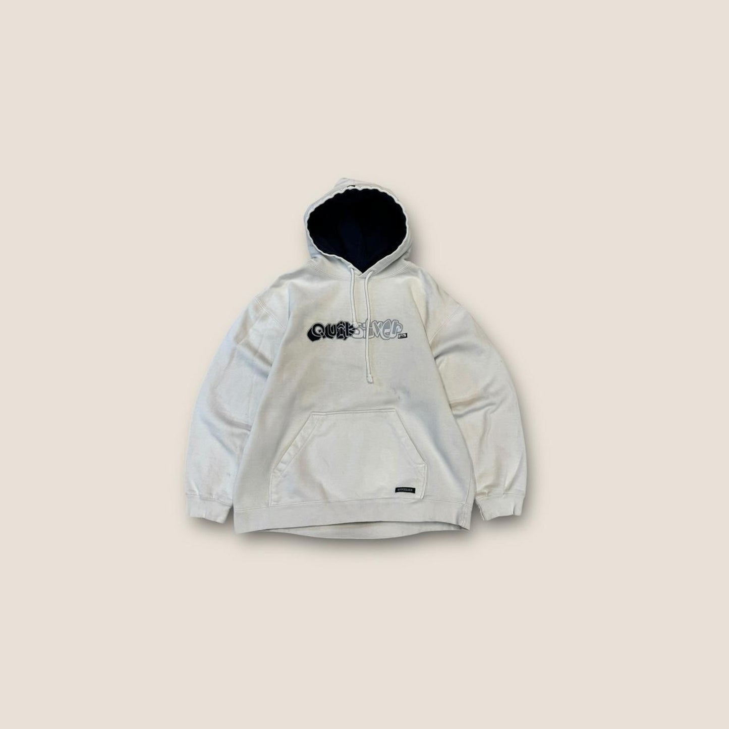 Quicksilver cream and black hoodie