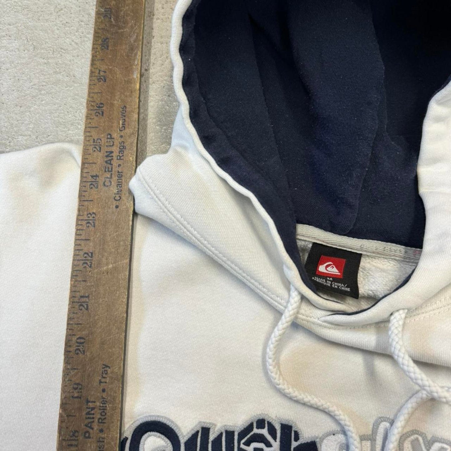 Quicksilver cream and black hoodie