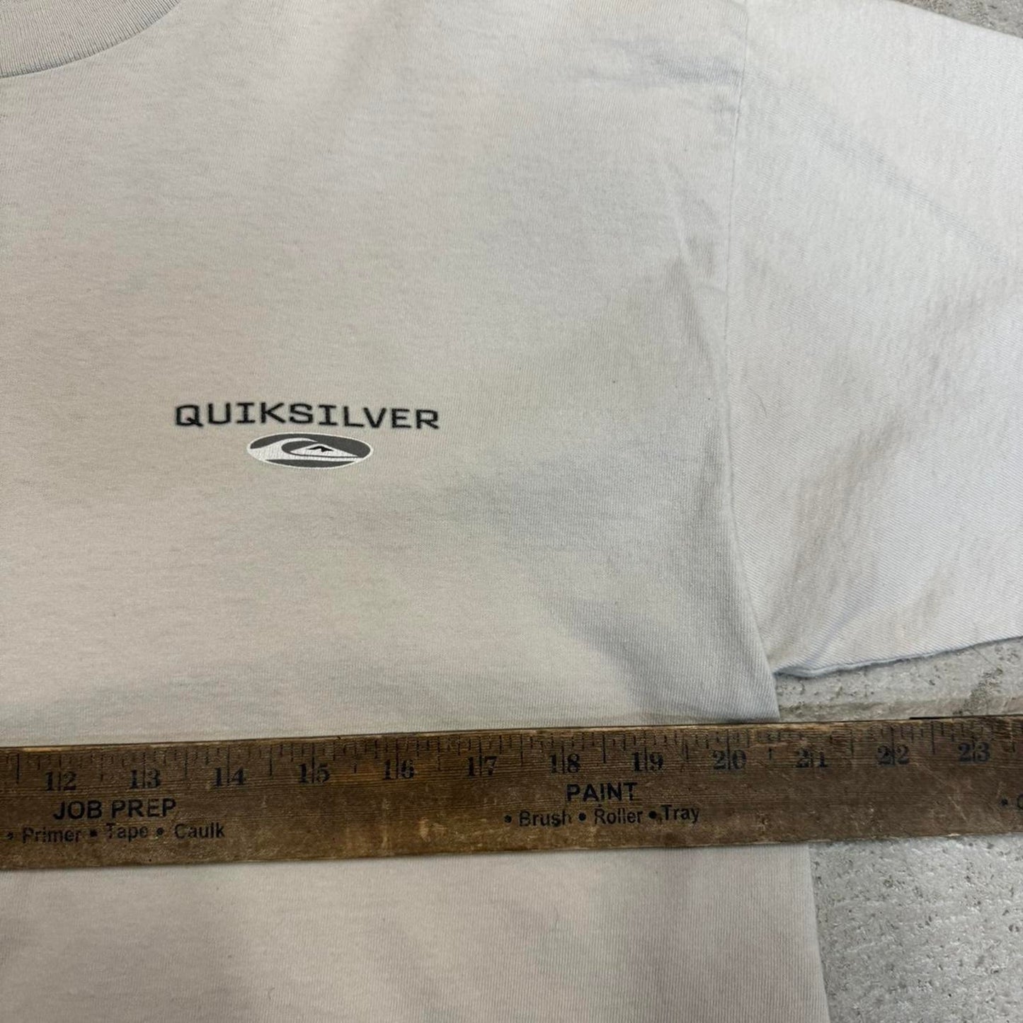 Quiksilver cream and black t shirt