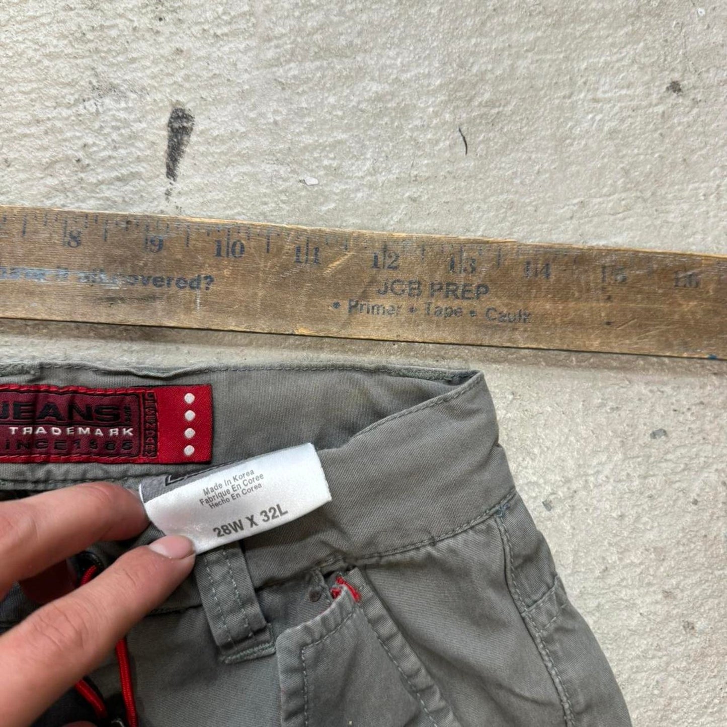 Grey cargo trousers with red